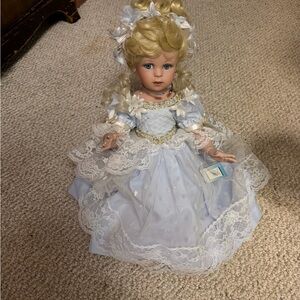 Charming Blonde Doll in White and Blue Dress